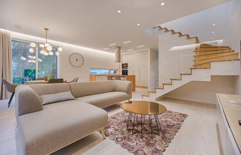 Warm minimalist Australian living room with natural timber furniture and soft afternoon light